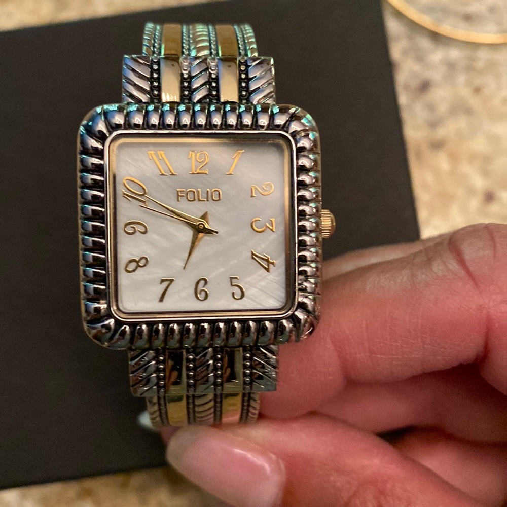 Folio bangle watch with gold and silver tones